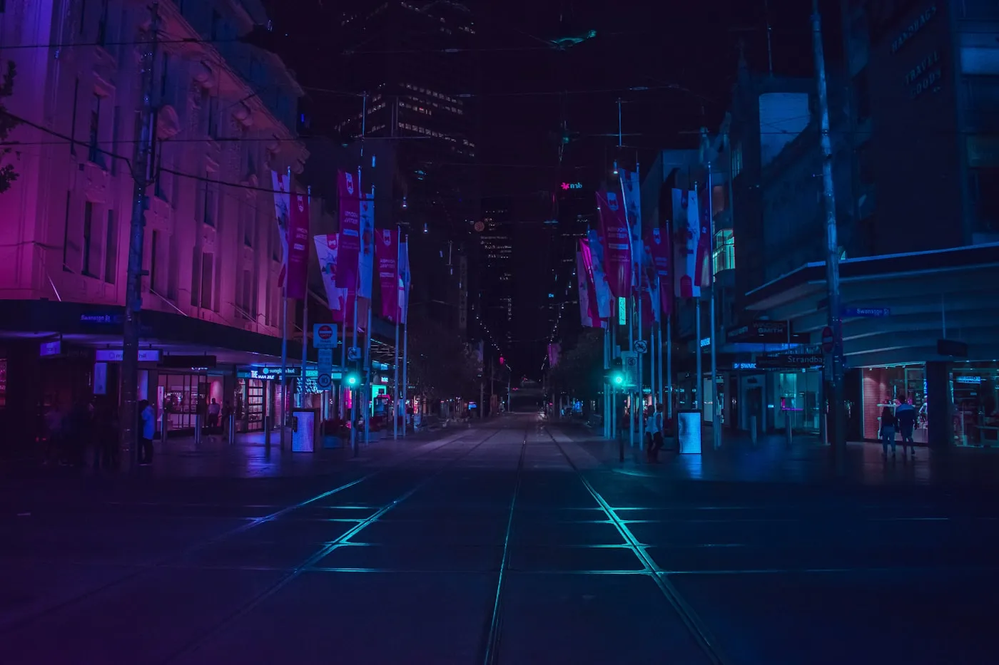 City lights under a cloudy evening sky